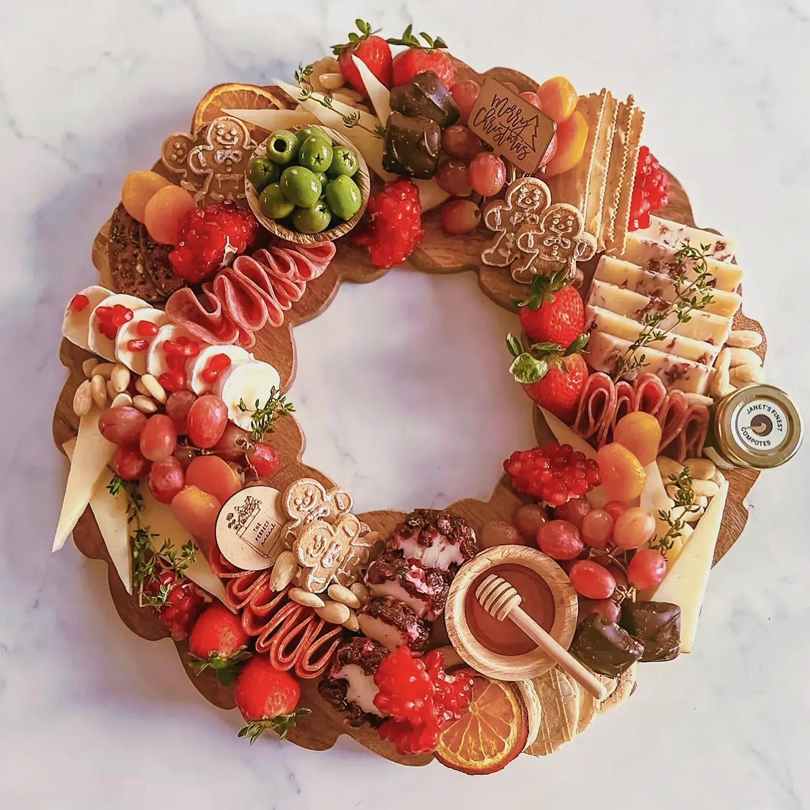 Colorful and vibrant wreath of fruits and vegetables on a marble surface