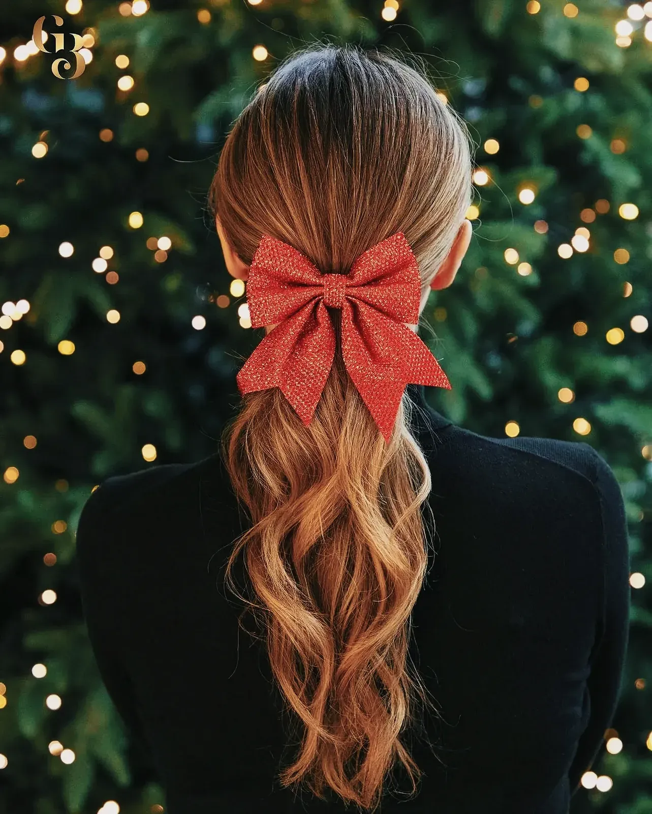 Woman with festive red bow in her hair standing near a decorated Christmas tree