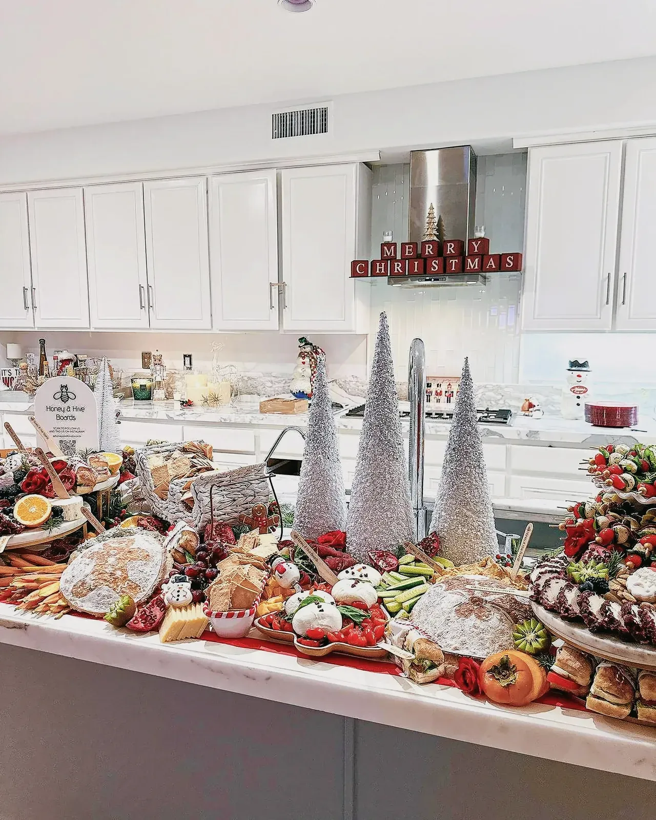 Festive Christmas-themed culinary scene with a variety of finger foods and snacks on a table.
