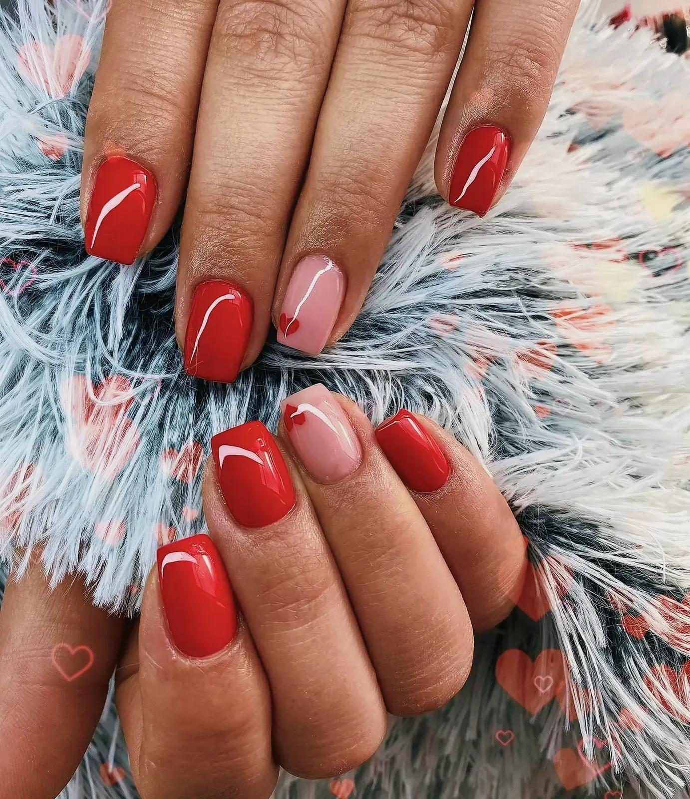 Close-up of vibrant red nails with a glossy finish