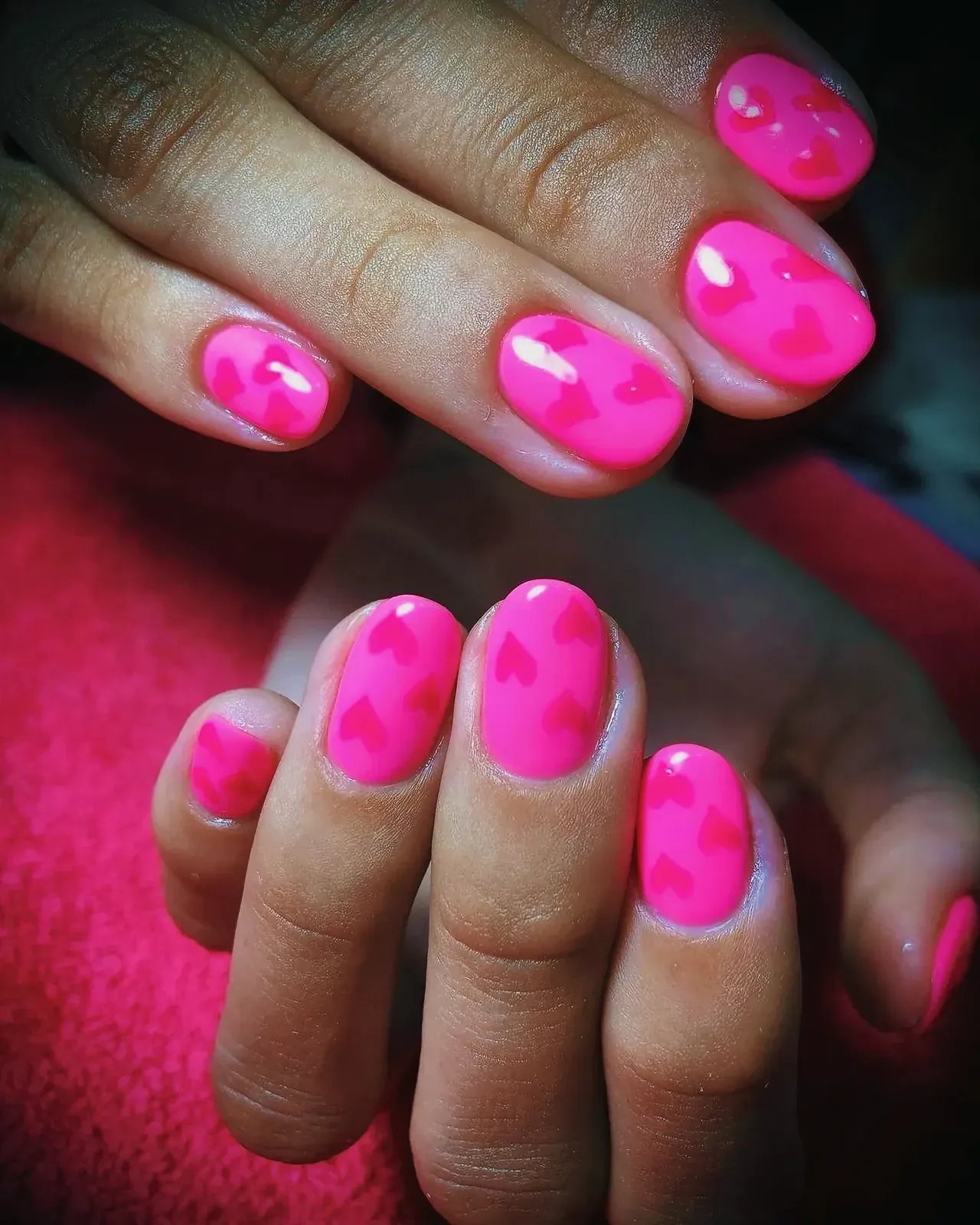 Close-up view of beautifully manicured pink nails