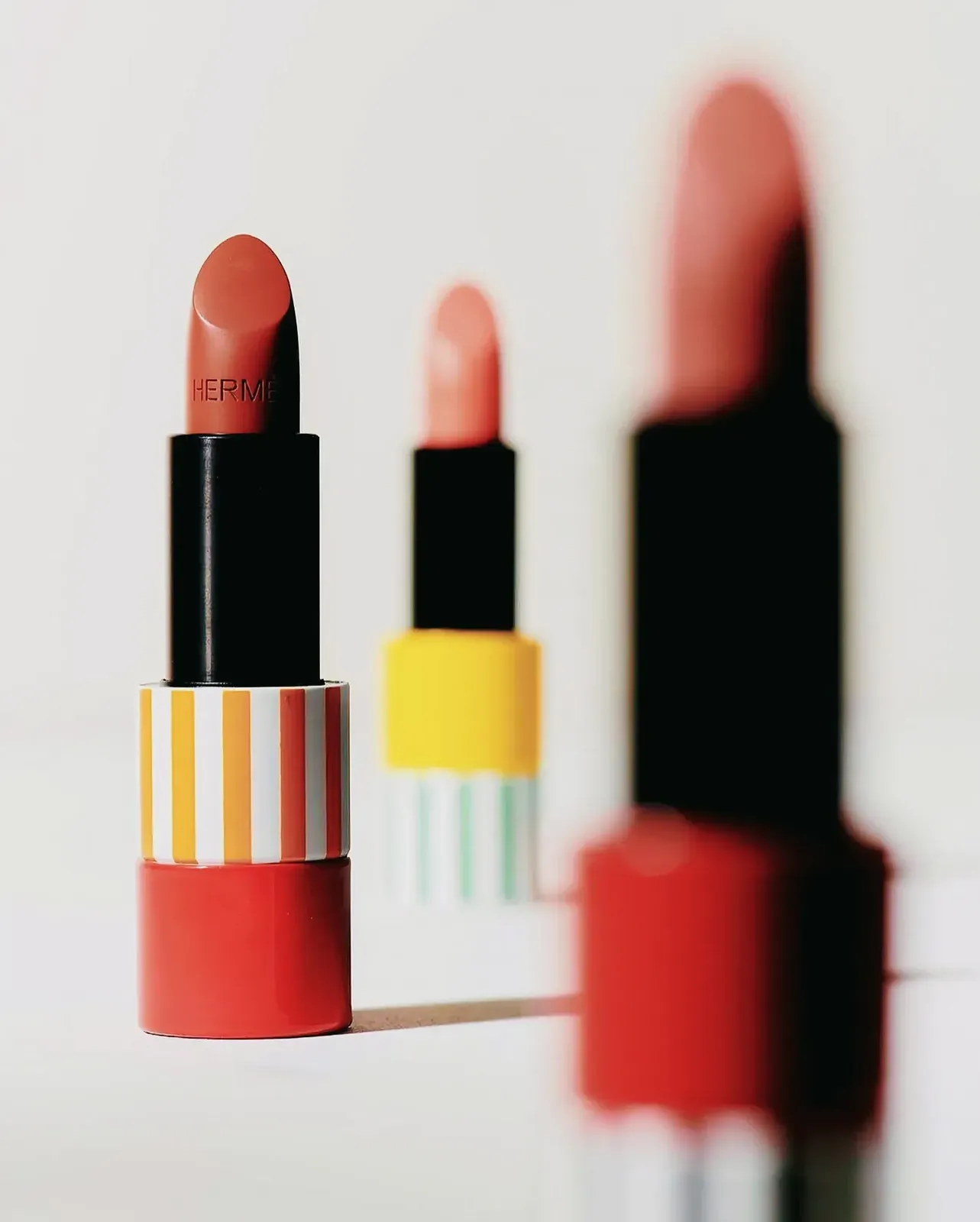 Enticing array of lipsticks displayed against a pristine white background.