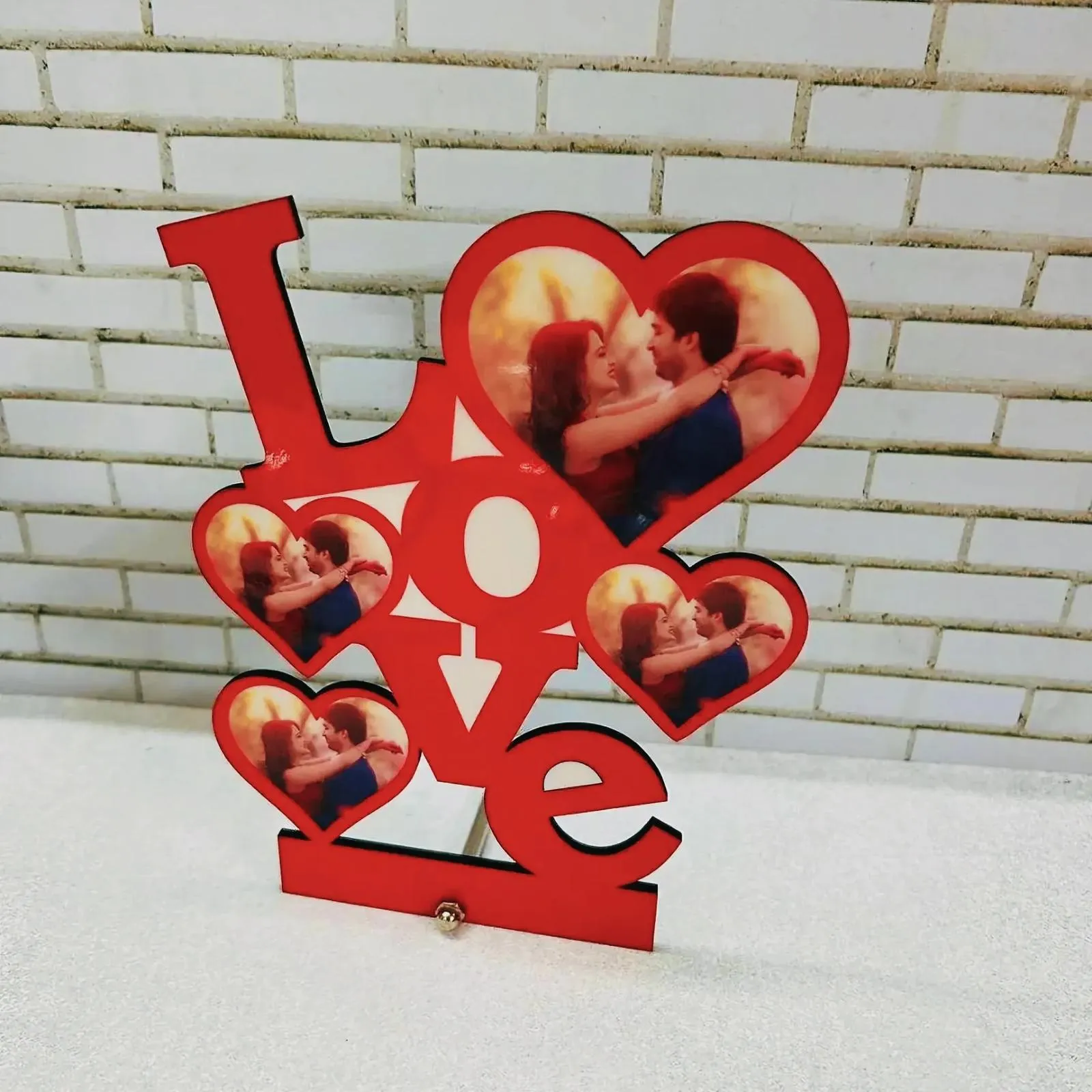 Heart-shaped picture frame showcasing a couple in an endearing display of love.