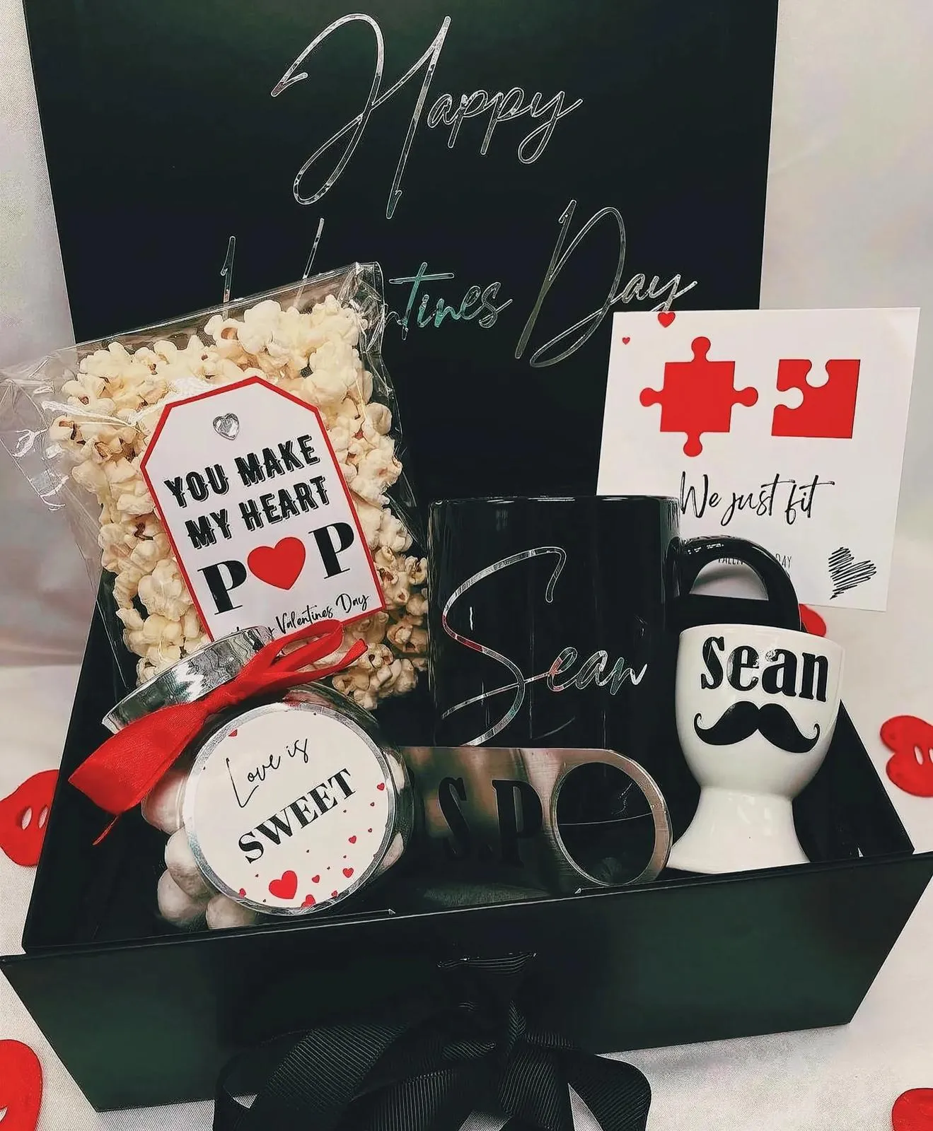 Various gift boxes and objects with a Valentine's Day theme.