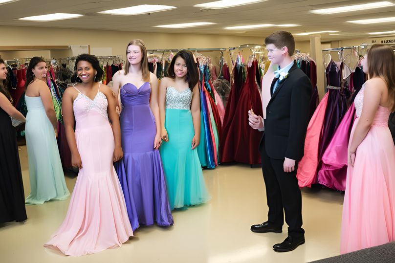 high school students trying on prom dresses - diversity